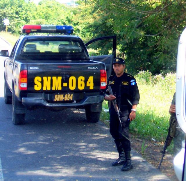 Friendly Uzi Carrying Side of the Road Guard
